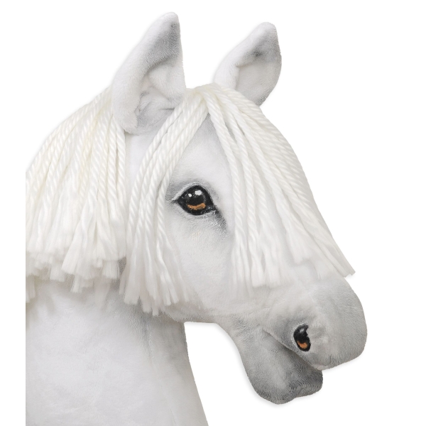 Wit paard met stok voor hobby horsing